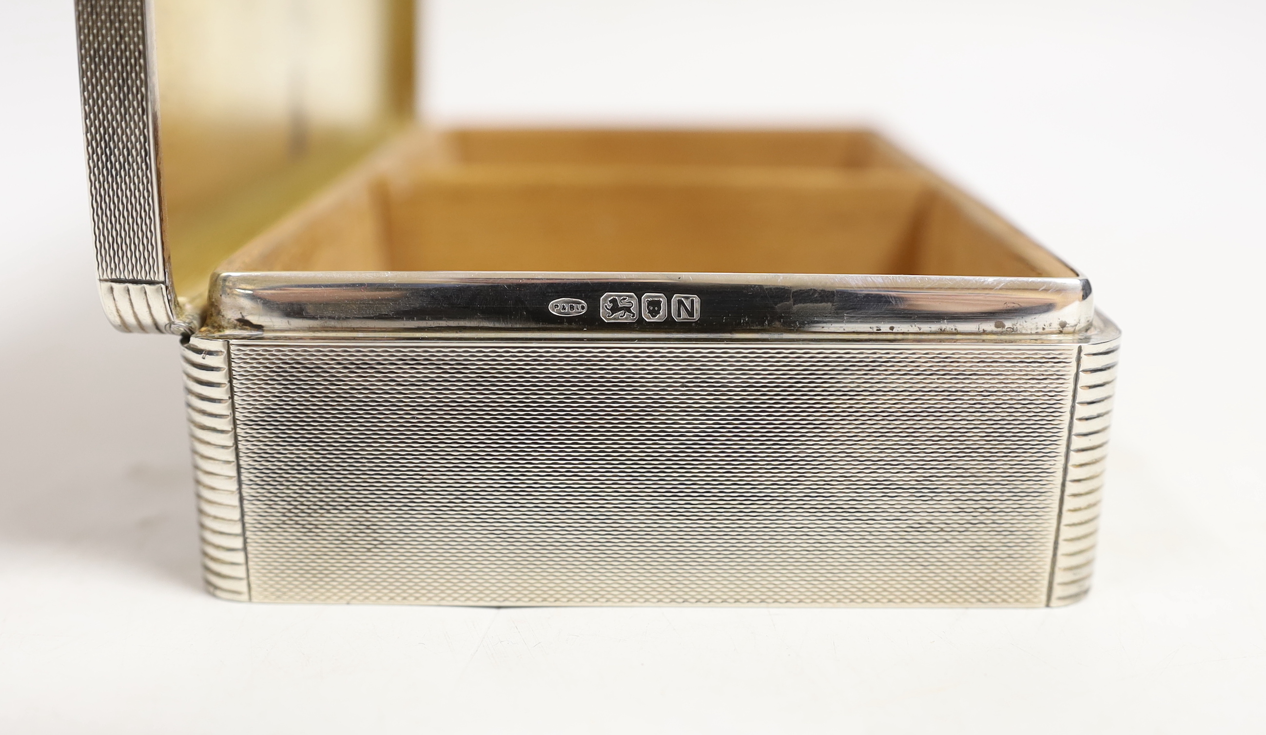A George VI engine turned silver mounted rectangular cigarette box, Padgett & Braham Ltd, London, 16.5cm.